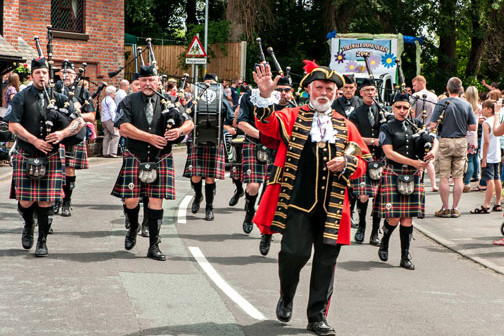 town crier leads parade