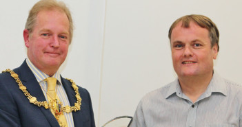 Cllr Geoff Settle presents award to Ken Fraser at National Volunteer Week celebration event at Orford Jubilee Hub