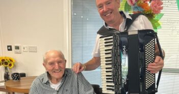 playing his accordion