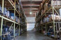 A large warehouse interior with steel racking and pallets Warrington warehouses