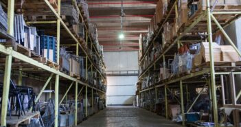 A large warehouse interior with steel racking and pallets Warrington warehouses