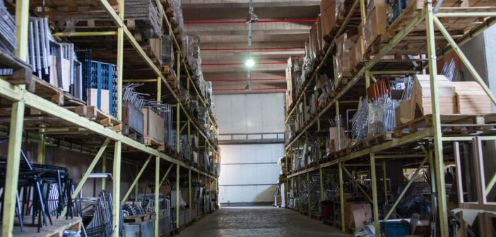 A large warehouse interior with steel racking and pallets Warrington warehouses